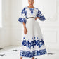 Elegant Blue and White Pleated Maxi Dress with Artistic Print