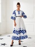 Elegant Blue and White Pleated Maxi Dress with Artistic Print